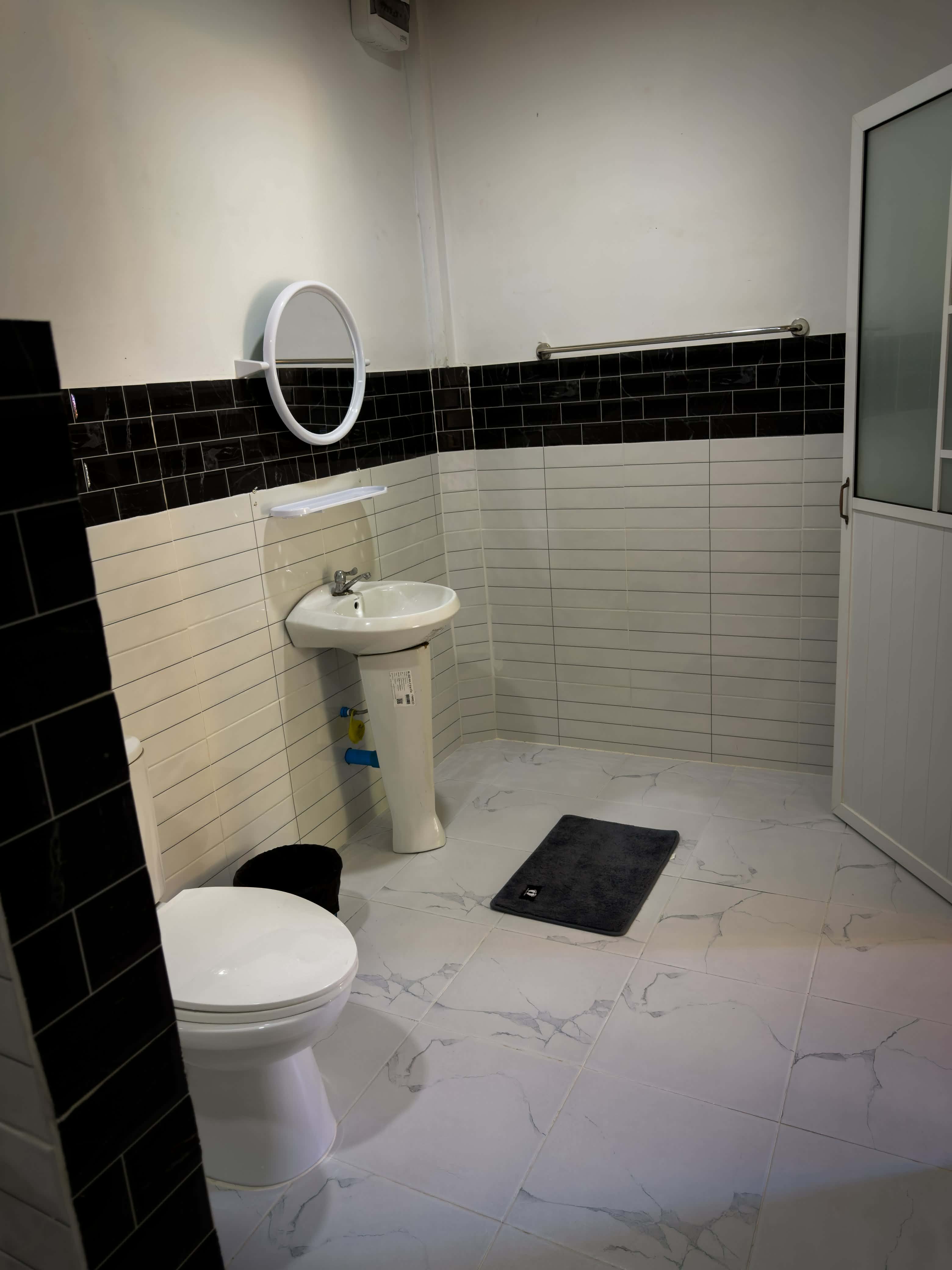Bathroom with rug and mirror