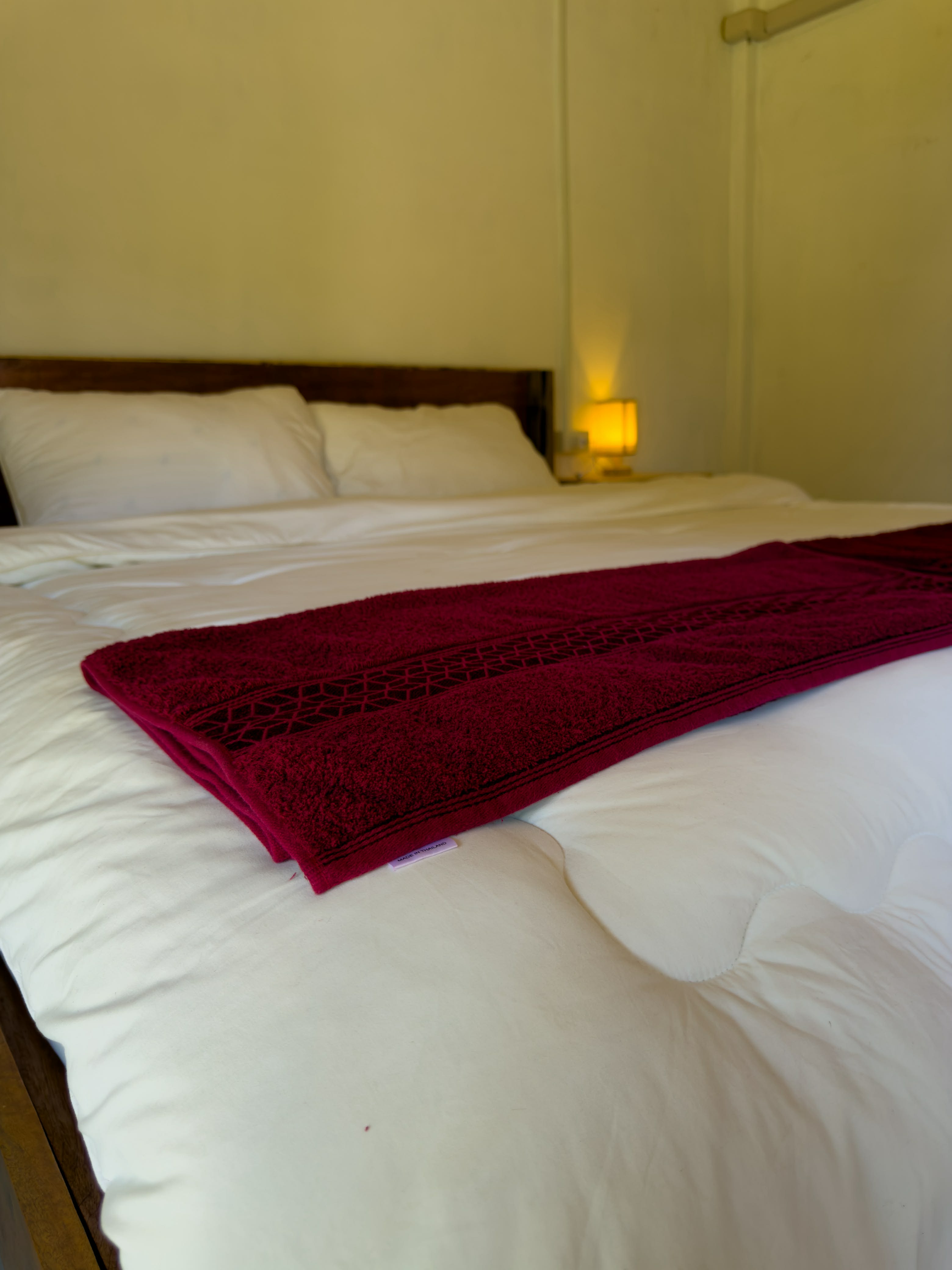 Clean towel and bed closeup